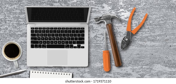 computer and many tools on brushed aluminimum background
