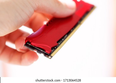 computer memory in technic hand. White background.