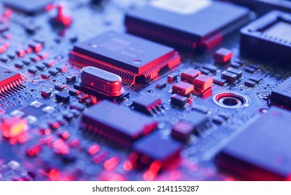 Computer Microchips on Electronic circuit board. Technology microelectronics concept background. Macro shot, selective focus, extremely shallow DOF. Noises and large grain - stylization under film.