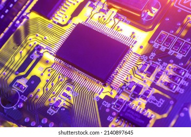 Computer Microchips and Processors on Electronic circuit board. Computer hardware technology. Abstract technology microelectronics concept background. Macro shot, shallow focus.