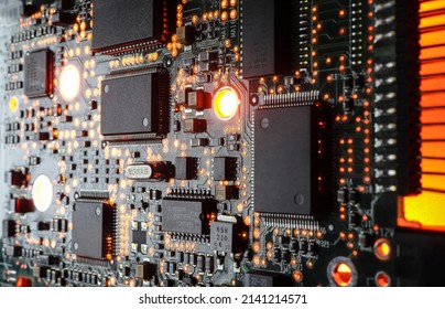 Computer Microchips and Processors on Electronic circuit board. Computer hardware technology. Abstract technology microelectronics concept background. Macro shot, shallow focus.