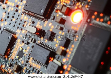 Computer Microchips and Processors on Electronic circuit board. Computer hardware technology. Abstract technology microelectronics concept background. Macro shot, shallow focus.