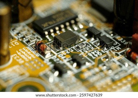 Computer microcircuit with electronic components, resistors and connection terminals, close-up shot