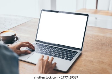 computer mockup image blank screen.hand woman work using laptop with white background for advertising,contact business search information on desk at coffee shop.marketing and creative design
