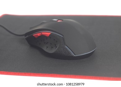 Computer Modern Gaming Mouse On Black Mouse Pad