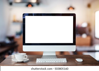 Computer Monitor, Keyboard,coffee cup and Mouse with Blank or White Screen Isolated is on the work table in 