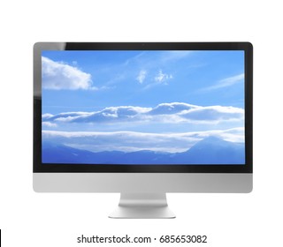 Computer monitor and wallpaper of landscape on screen, white background