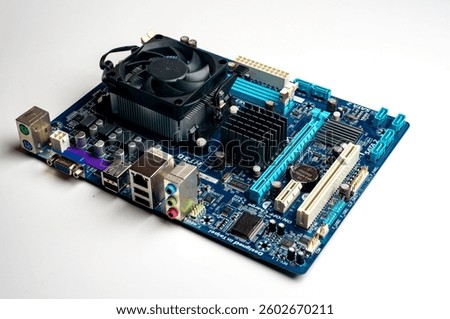 Computer motherboard with cooling on white background