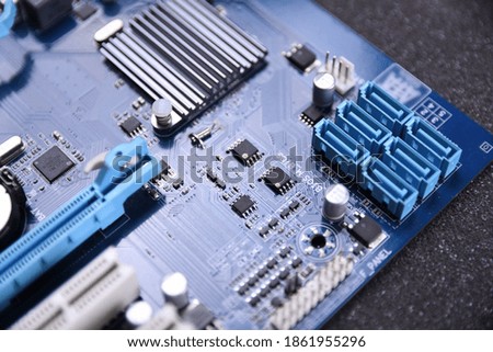 Computer motherboard and electronical components cpu gpu memory and different sockets for a video card close up