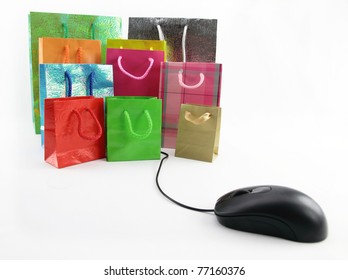 Computer mouse connected to a group of shopping bags