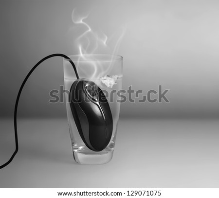 Computer mouse in a glass Water