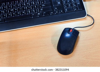 computer mouse on table and keybord.