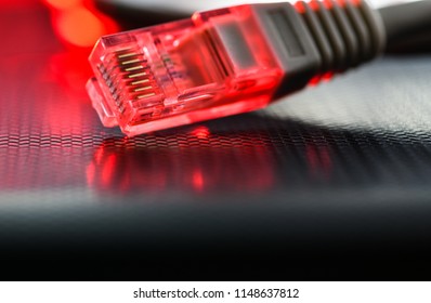 Computer network cable. The local wire lies on the ribbed surface highlighted in red. Macro