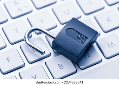 Computer and network Security Vulnerability concept. Open padlock on keyboard