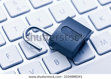 Computer and network Security Vulnerability concept. Open padlock on keyboard