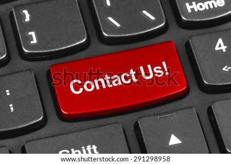 Computer notebook keyboard with Contact Us key - technology background