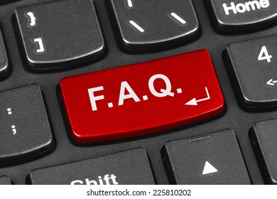 Computer notebook keyboard with FAQ key - technology background