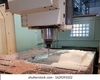 A Computer Numerical Control or CNC machine is automatically milling a hard Polyurethane foam follow a CAD or computer-aided design drawing file.   - Powered by Shutterstock