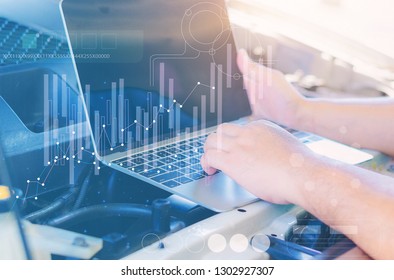 Computer officer Check the engine system with the laptop, fix the system problem - Shutterstock ID 1302927307