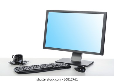 computer on a desk in a bright office. Isolated on white background