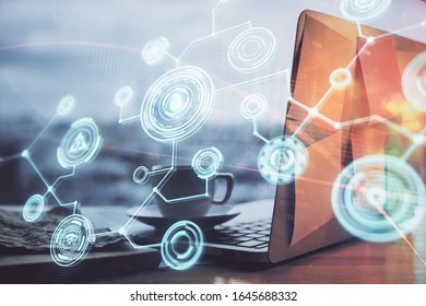 Computer on desktop with social network hologram. Multi exposure. Concept of international people connections. - Shutterstock ID 1645688332