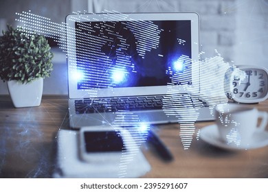 Computer on desktop with social network hologram. Double exposure. Concept of international people connections. - Shutterstock ID 2395291607