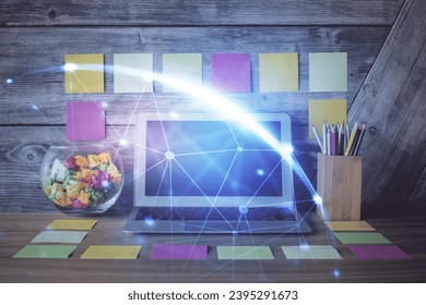 Computer on desktop with social network hologram. Double exposure. Concept of international people connections. - Shutterstock ID 2395291673