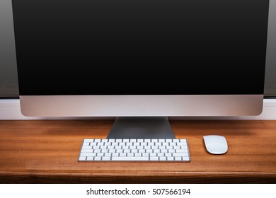 computer on a table in an office