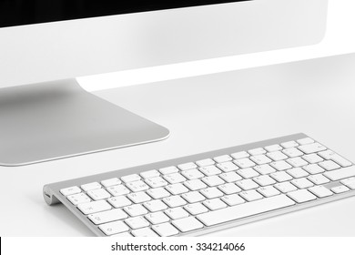 Computer on white table, close-up, monitor, keyboard