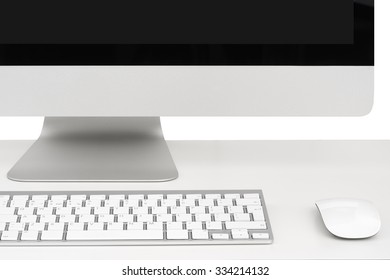 Computer on white table, close-up, monitor, keyboard and mouse