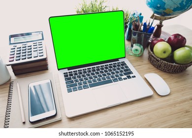Computer peripherals & laptop accessories on wooden table, close up