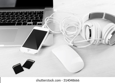 Computer Peripherals And Laptop Accessories On White Wooden Background