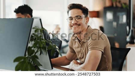 Computer, portrait and web development with smile of man in creative workplace for coding or design. Cybersecurity, happy and system infrastructure with employee person in office as website developer