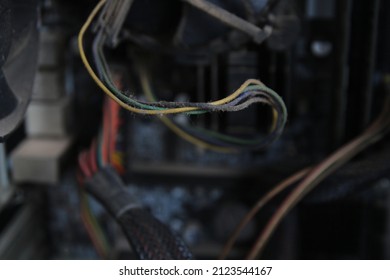 A Computer Power Cable Network That Will Be Cleaned In A Low Light Room.