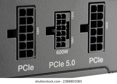 Computer power supply unit isolated on white background. Power supply for motherboard computer. PCIe 5.0 Power Connector 600W. PCI express	
