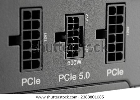 Computer power supply unit isolated on white background. Power supply for motherboard computer. PCIe 5.0 Power Connector 600W. PCI express	
