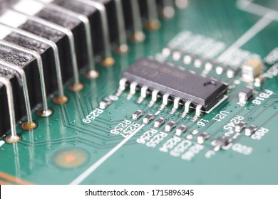 Computer printed circuit board with electronic components and microprocessor, Electronic circuit board close up with shallow focus.