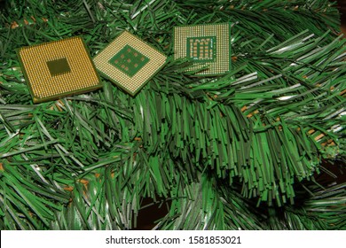 Computer processors on a Christmas tree branch. Merry Christmas and Happy New Year symbol. Festive background