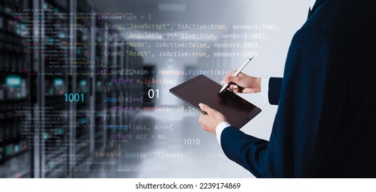 Computer programmer working on big data and computer code in a data center or server room. Data processing, digital technology, and the concept of an internet network. - Powered by Shutterstock