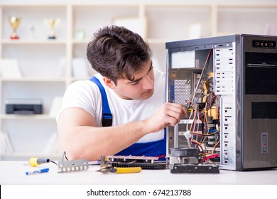 Computer Repairman Repairing Desktop Computer