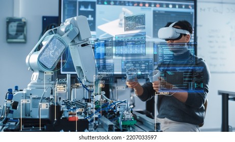 Computer Science Engineer in Virtual Reality Headset Using Controllers and Operating Robot Arm Under his Control. VFX Augmented Reality Interfaces and Icons Demonstrate Innovative Technologies.