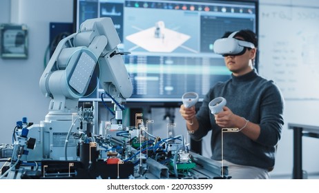 Computer Science Engineer in Virtual Reality Headset Using Controllers and Operating Robot Arm Under his Control. VFX Augmented Reality Icons Demonstrate Innovative Technologies Concept. - Powered by Shutterstock