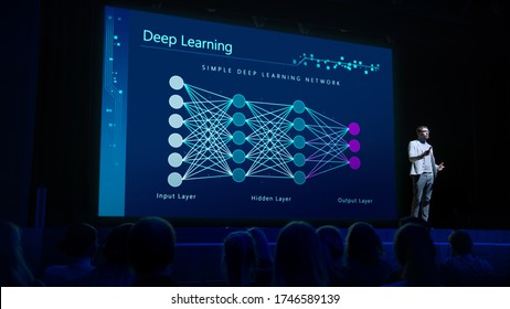 Computer Science Startup Conference: On Stage Speaker Does Presentation Of New Product, Talks About Neural Networks, Shows New AI, Big Data And Machine Learning App On Big Screen. Live Event