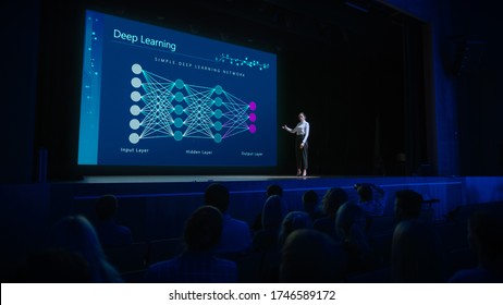 Computer Science Startup Conference: On Stage Speaker Does Presentation Of New Product, Talks About Deep Learning, Shows New AI, Big Data And Machine Learning App On Big Screen. Live Event