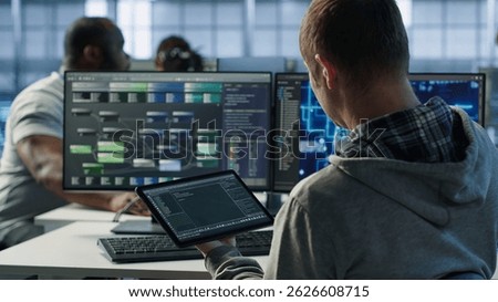 Computer scientist in data center uses artificial intelligence neural networks doing computing processes. IT specialist working on tablet with AI machine learning algorithms, camera A