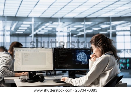 Computer scientist doing data center automation using AI and machine learning tools. IT expert integrating artificial intelligence driven automation in server hub operations