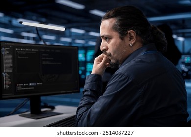 Computer scientist doing maintenance in server room to extend equipment life span and avoid downtime. IT professional monitoring rackmounts for overheating problems and power fluctuations
