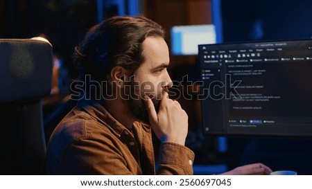 Computer scientist drinking cup of coffee while developing code on PC using java programming languages. IT admin brainstorming ways of fixing database errors, enjoying hot beverage, camera A