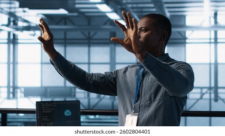 Computer scientist looking at holograms in data center, using artificial intelligence. African american admin interacting with augmented reality AI visualization in server hub, camera A - Powered by Shutterstock - Get 15% off with code: PIKWIZARD15