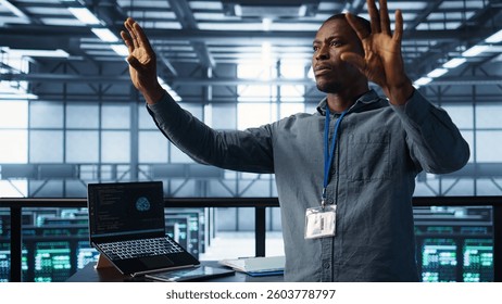 Computer scientist looking at holograms in data center, using artificial intelligence. African american admin interacting with augmented reality AI visualization in server hub, camera B - Powered by Shutterstock - Get 15% off with code: PIKWIZARD15